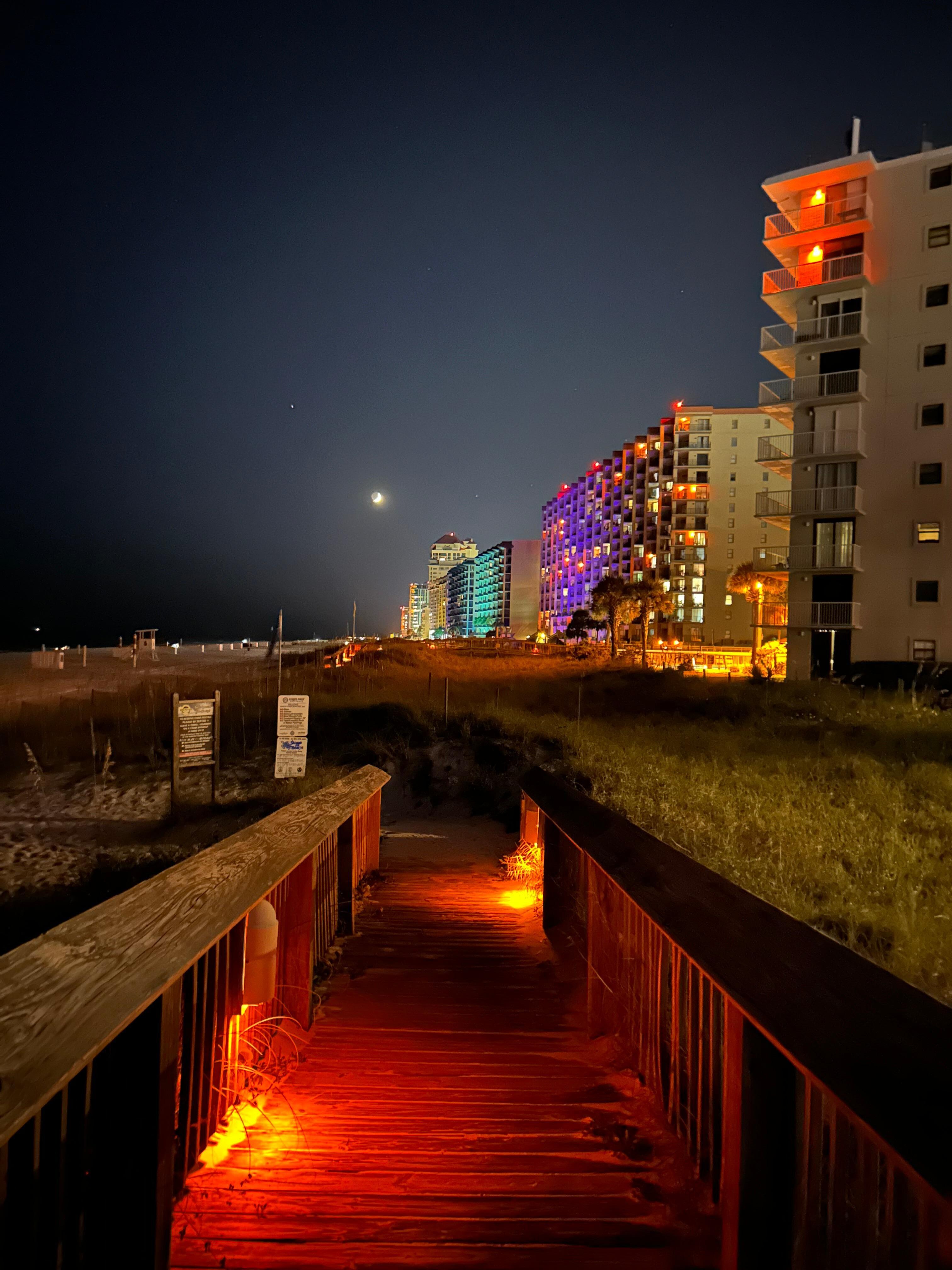 Night time view from walkway to beach.