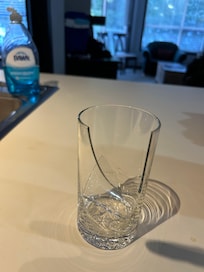 Broken glass in cupboard along with dirty dishes (no photo of these)