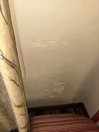 Terrible wall repair by the window.