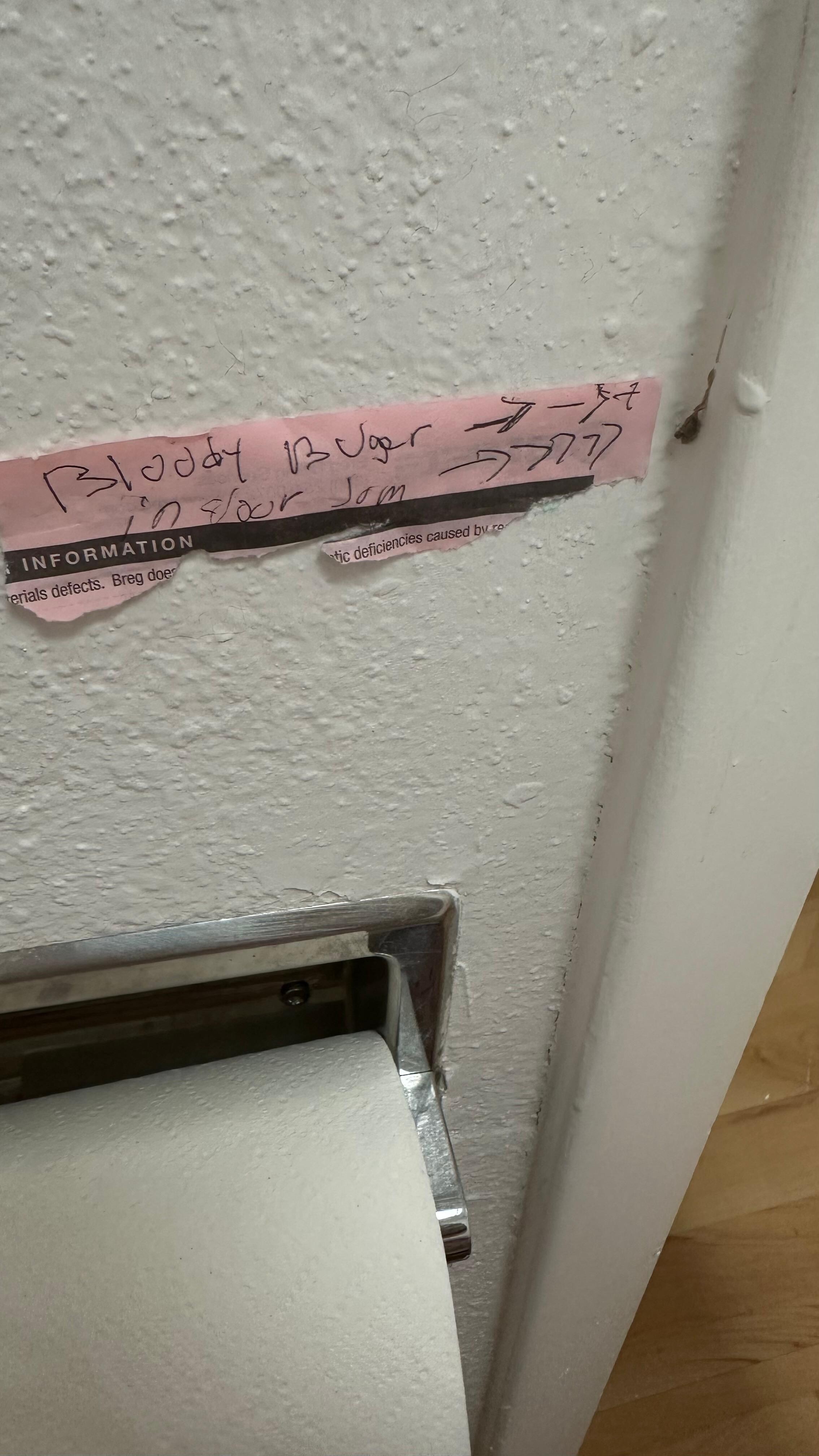 Dried bloody booger on the door jam.