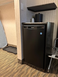 Mini fridge, luggage rack, iron and board, nice entry for shoes and coats.