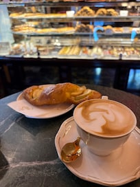 Daily breakfast included in stay from a cafe in the square. Cappuccino and pastry