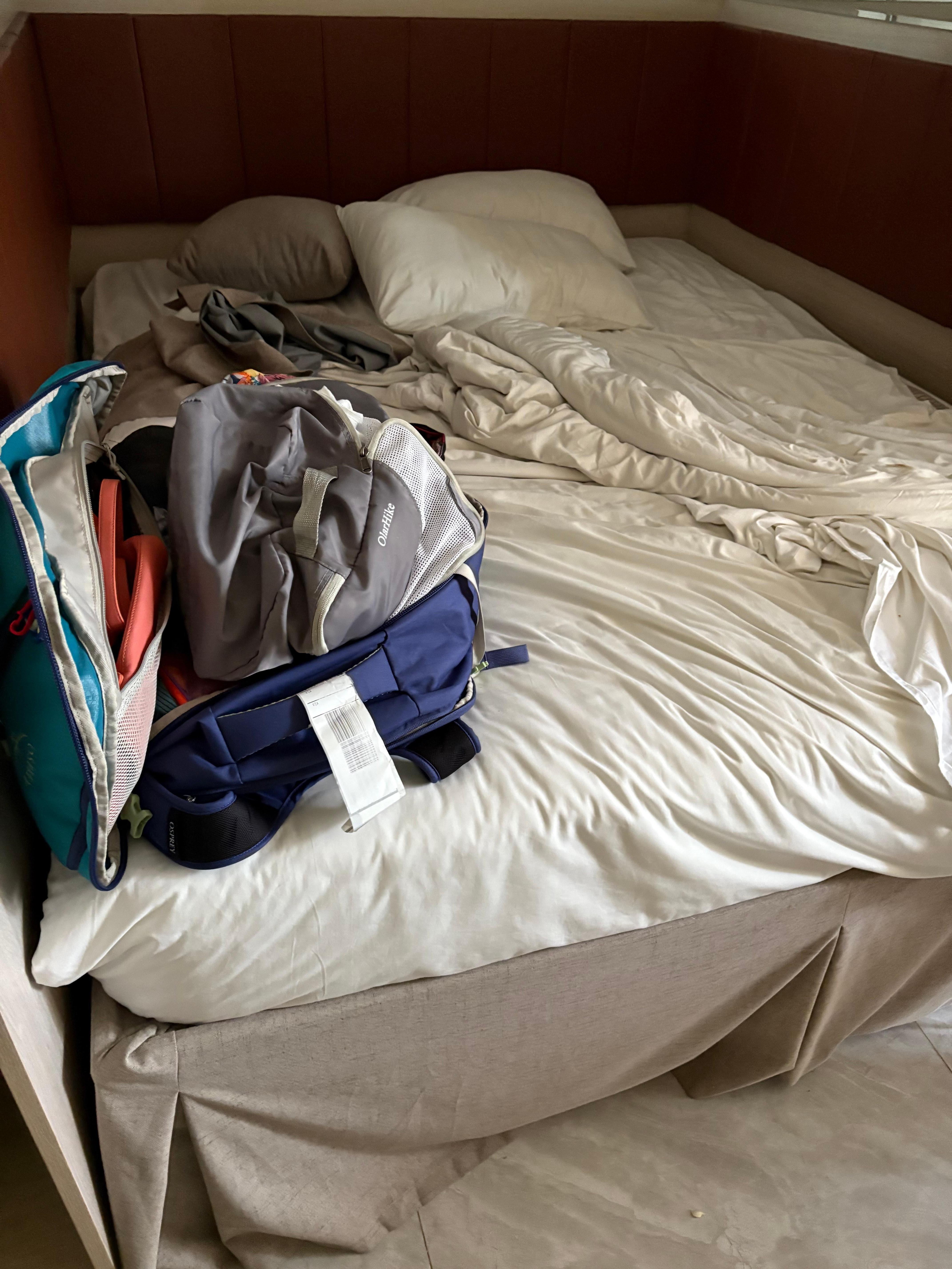 Bed enclosed on 3 sides- I had to crawl in from the bottom and hurt knee on frame