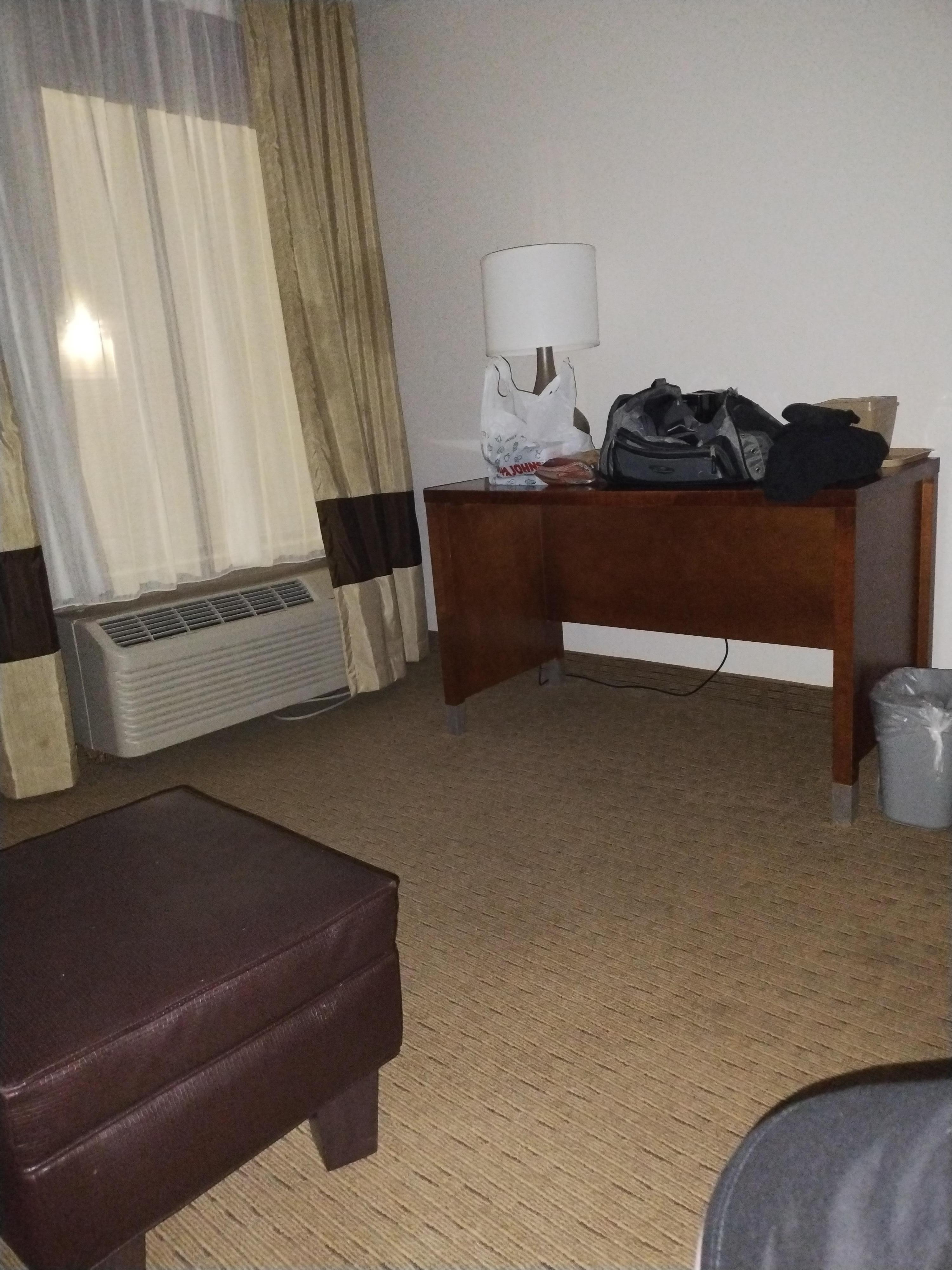 You can see the light coming in the window, and the outer curtains could not be closed any further. That light is on the building across the way.