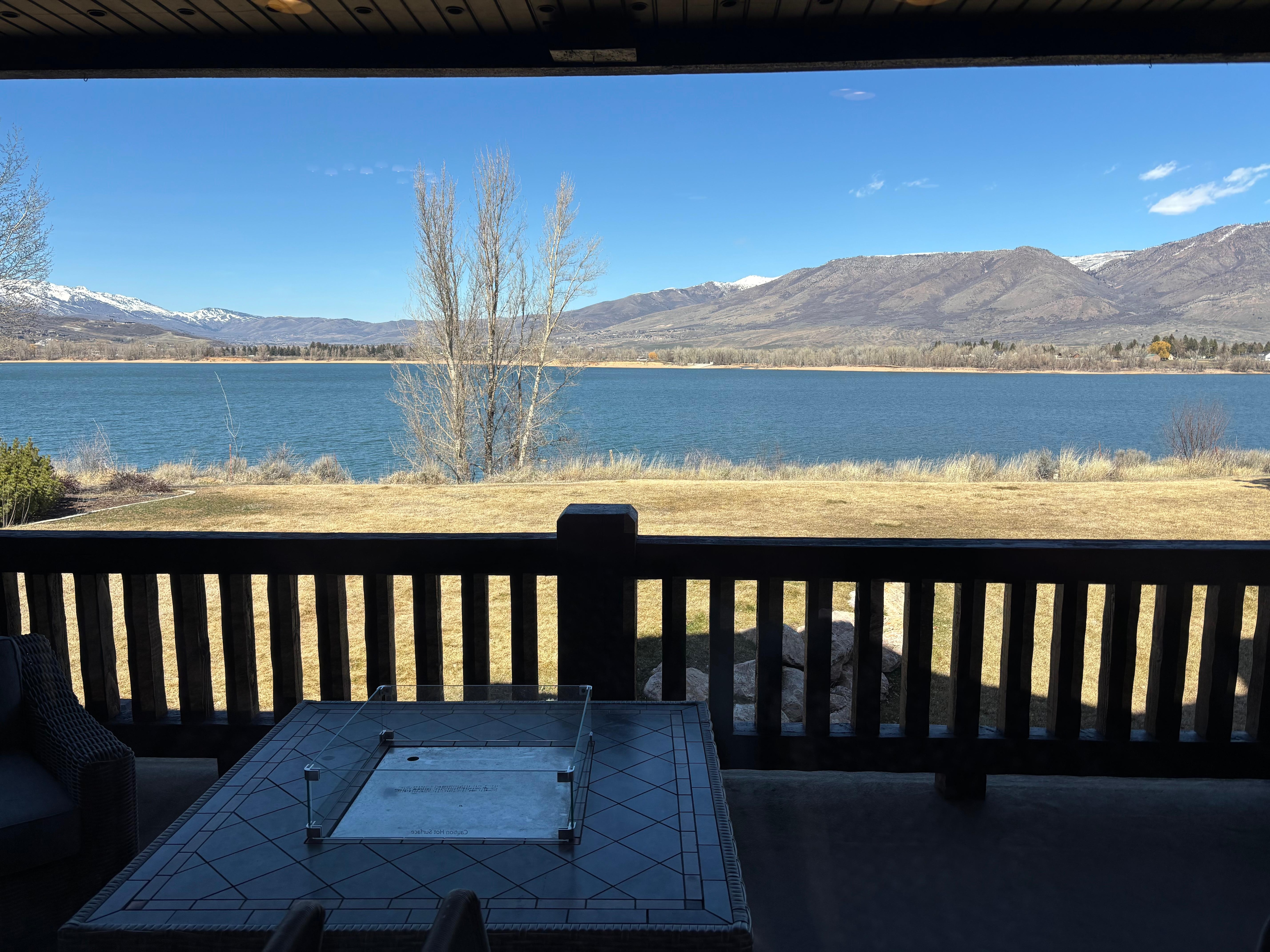 Lake view from deck - fire pit and comfy chairs.