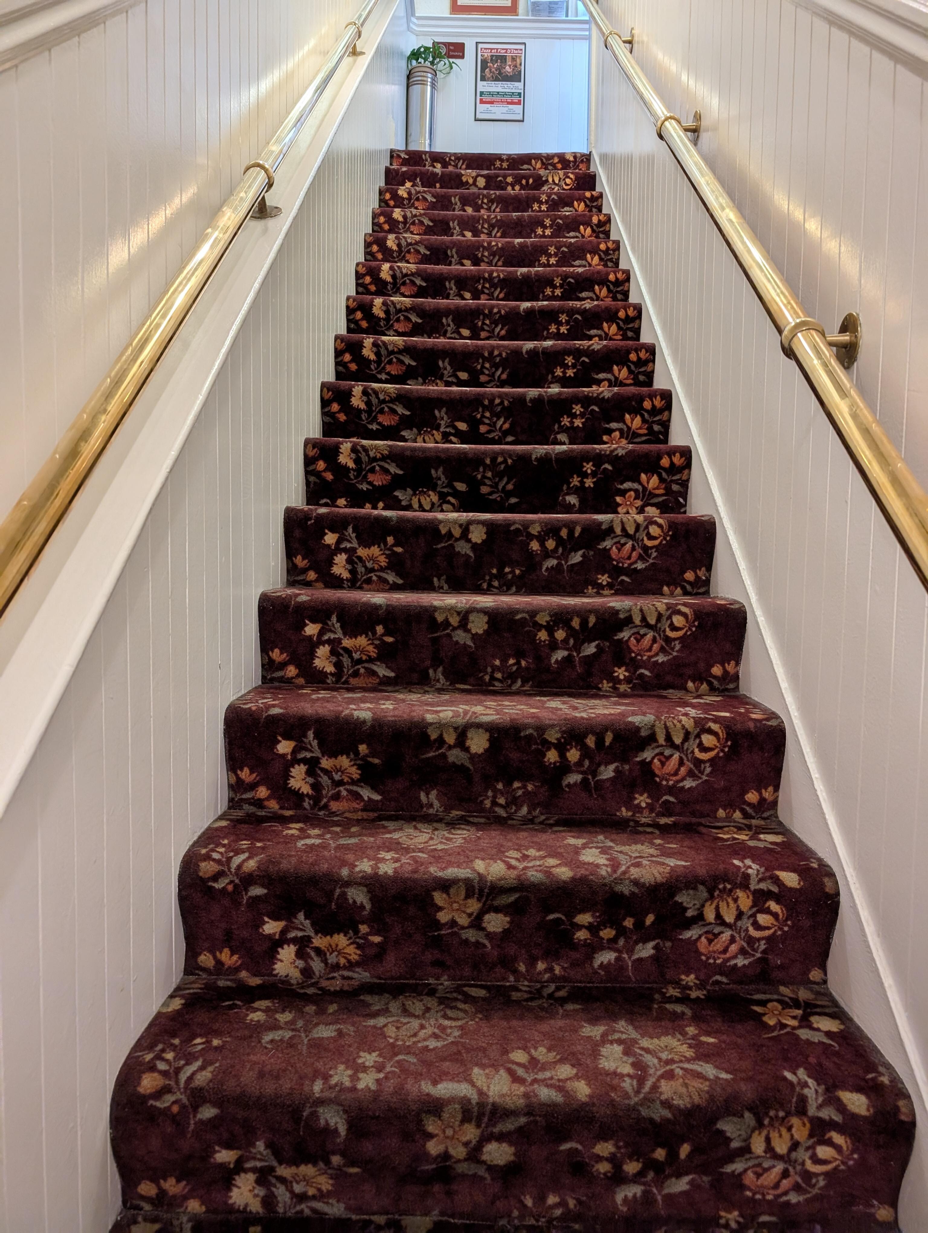 Stairs going up to get checked it. 