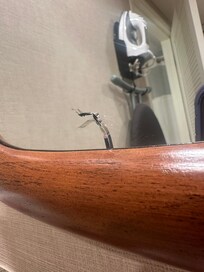 Crack in a mirror of the renovated room.