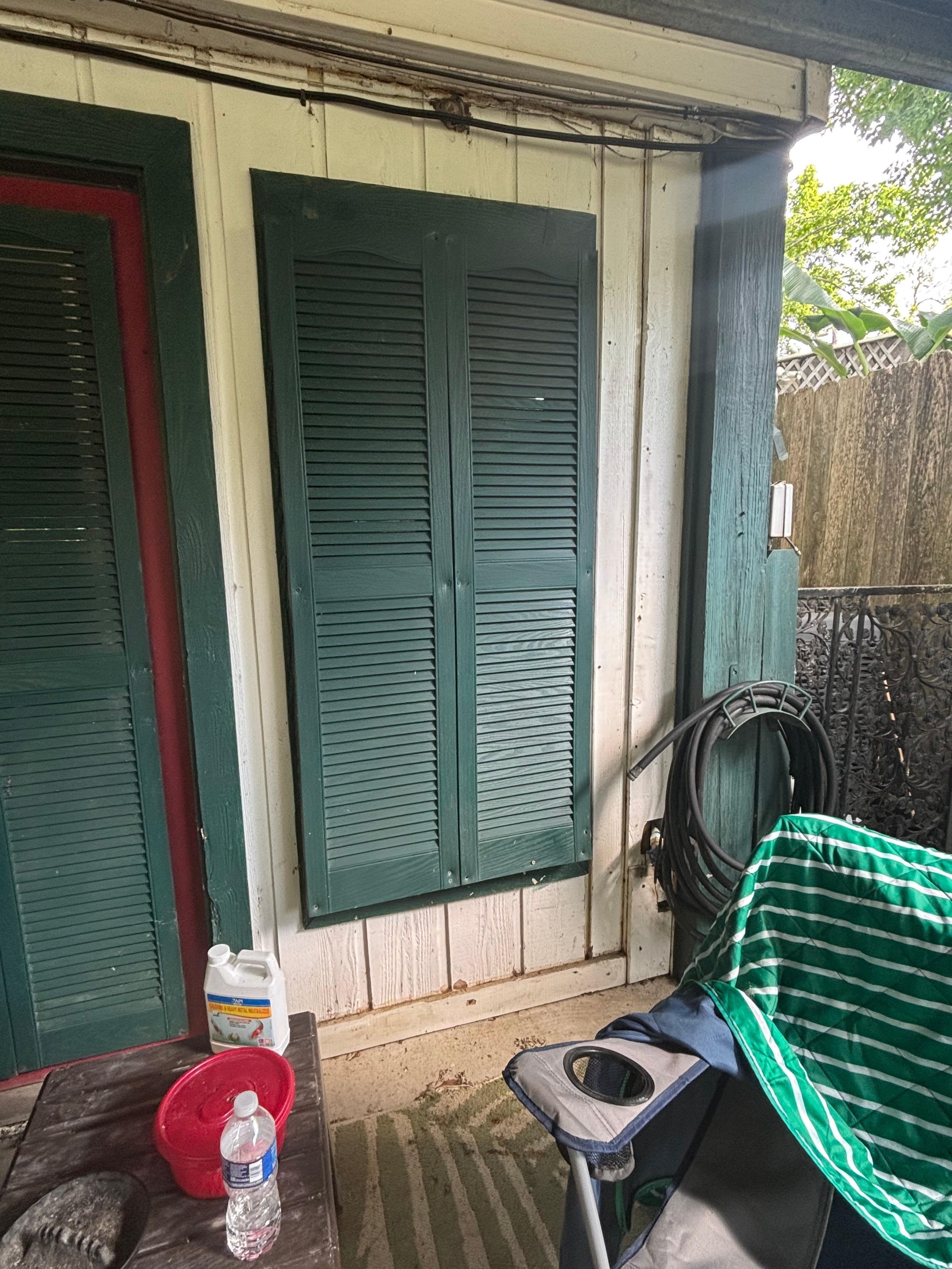 These are the plastic shutters that are screwed in over the windows. They are very flimsy so I don’t think they are hurricane grade but more for looks.