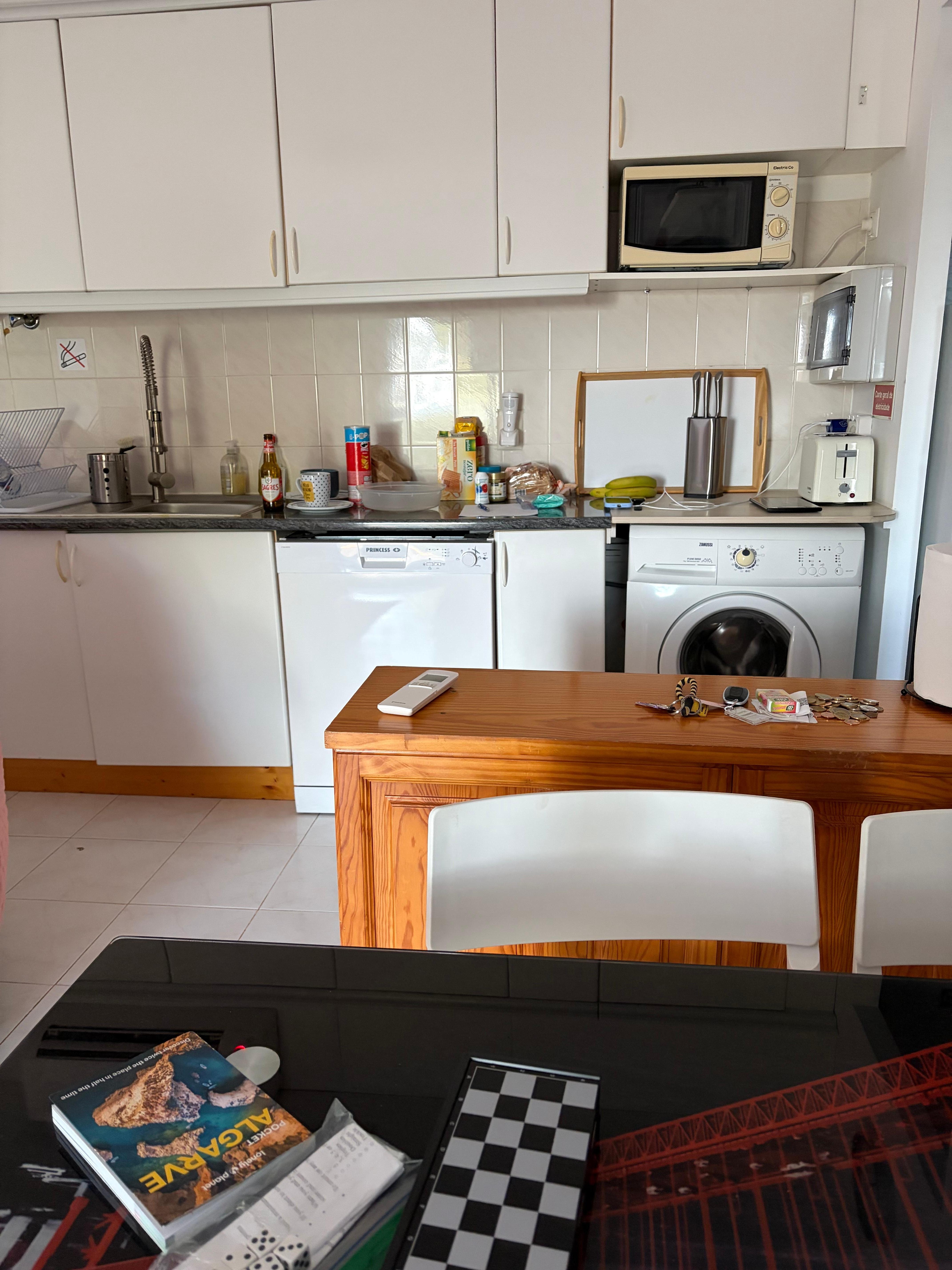 Kitchen with dishwasher & washing machine.
