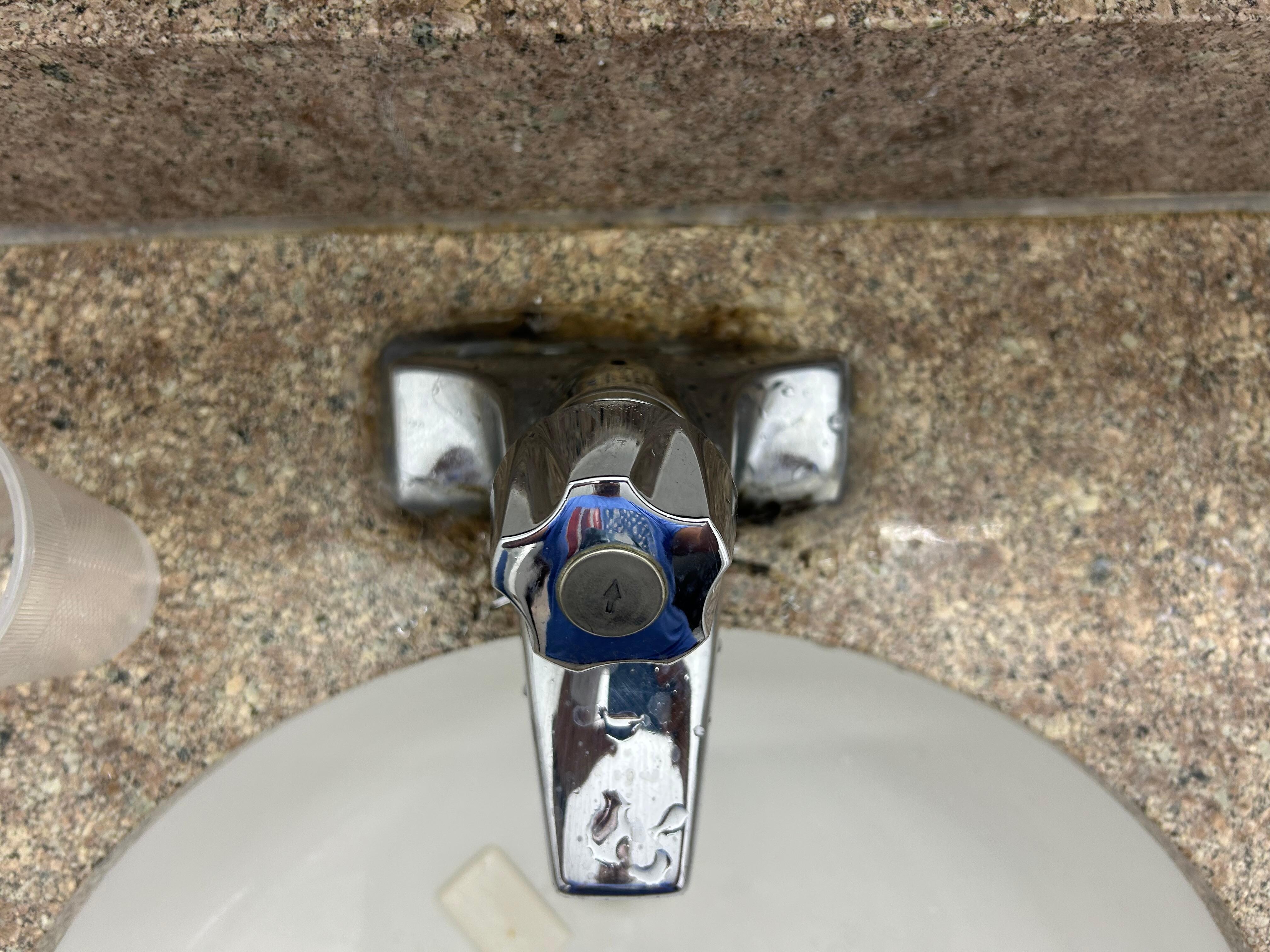 Mold throughout silicone on faucet