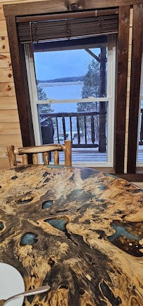 Beautiful Unique raw wood table with epoxy eith a gorgeous lake view