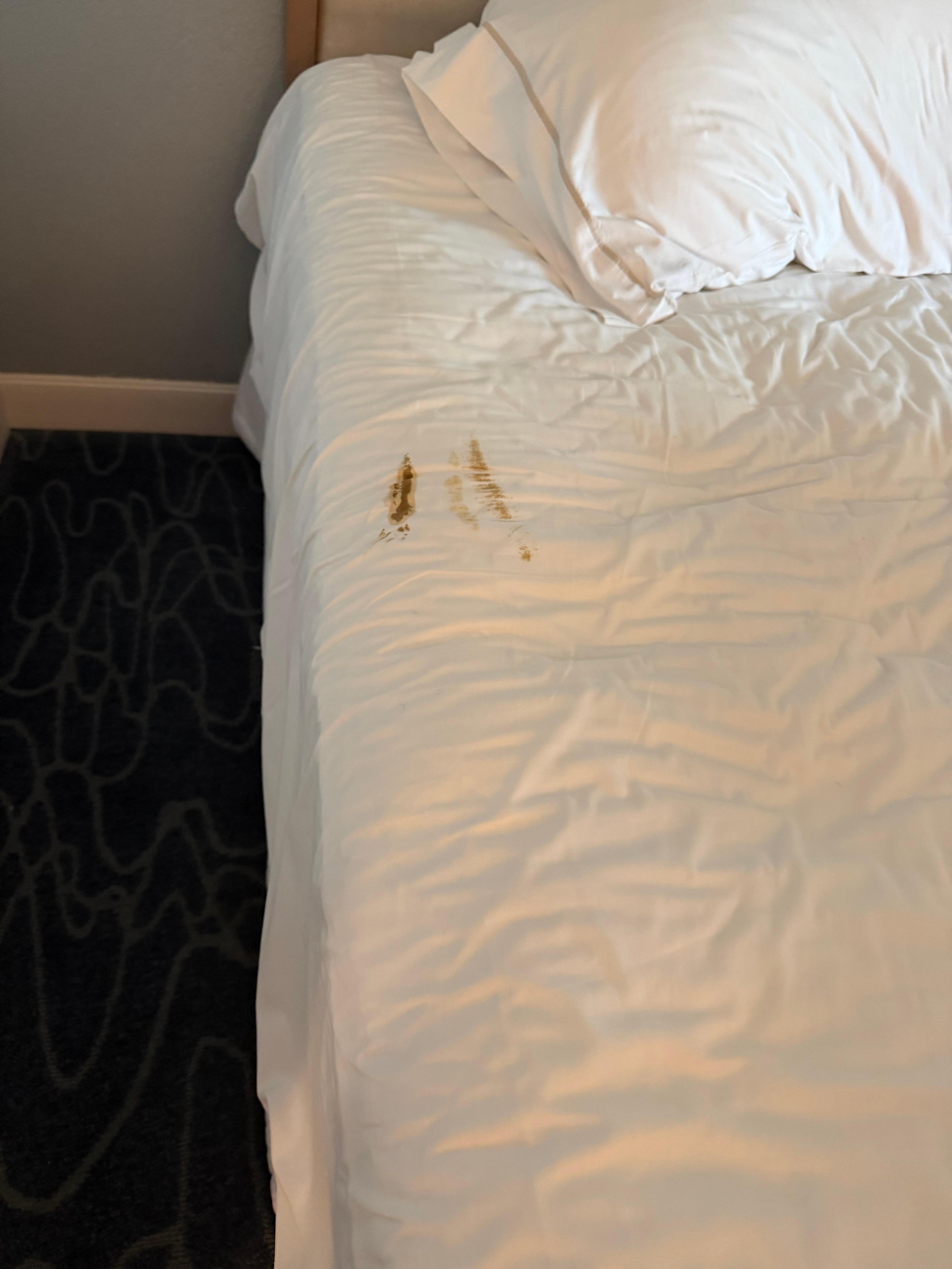 Bed with shit stains on them. 