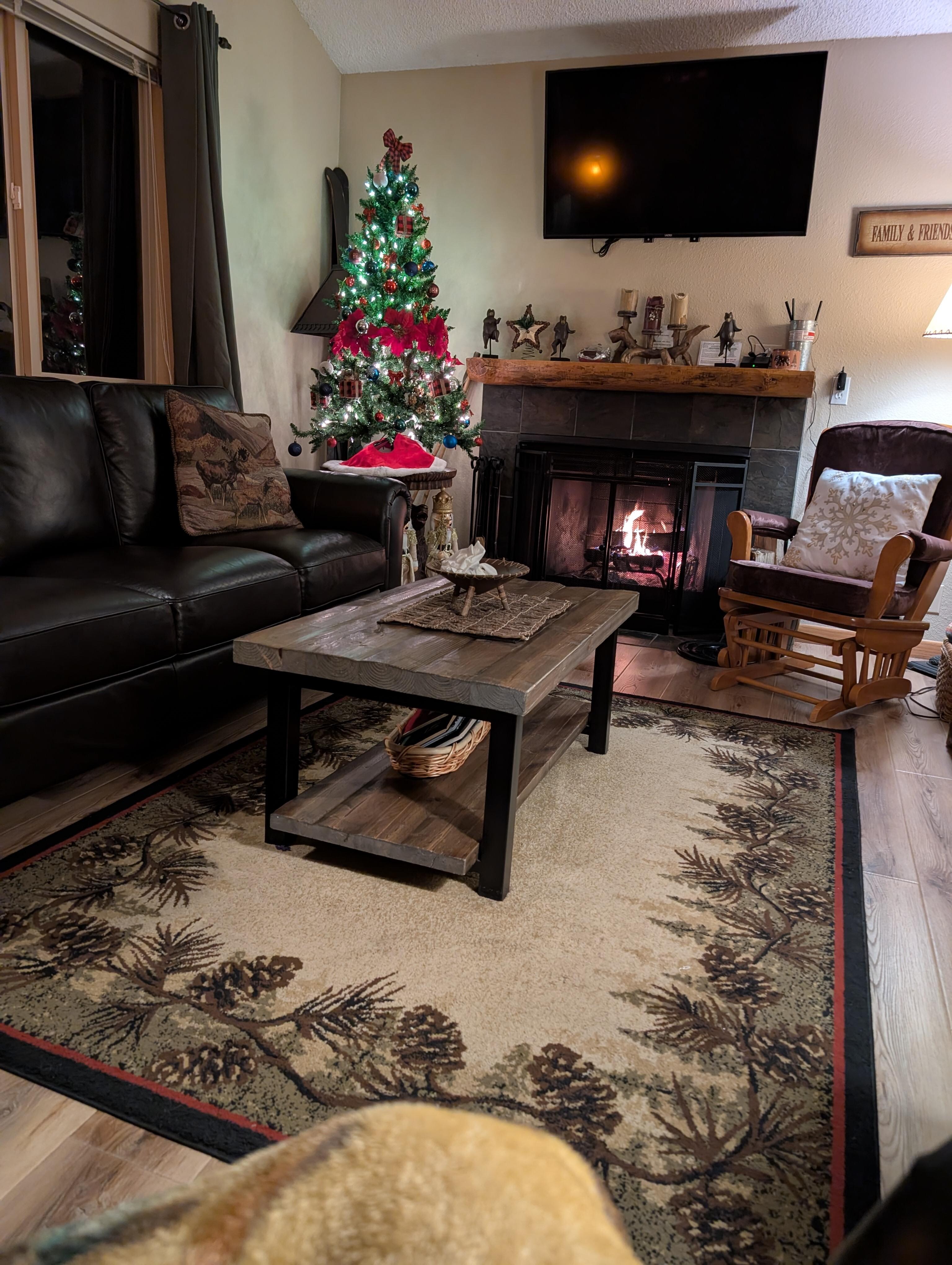 Upstairs living area with wood burning fireplace