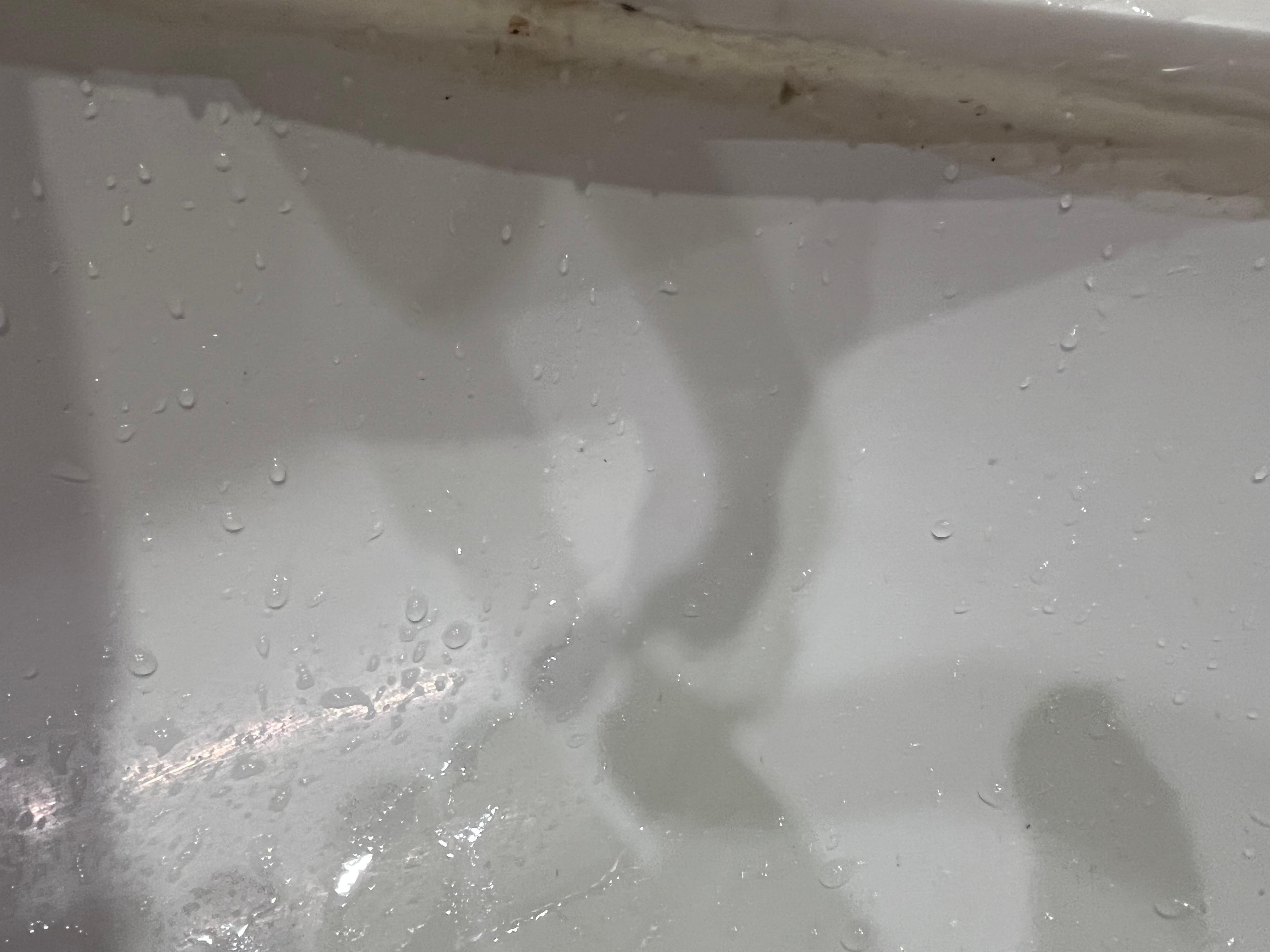 Under the rim of the sink