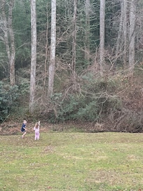 The kids running around with the squirrels! They were so excited they even built them a “bridge” of sticks for them to get across the stream!