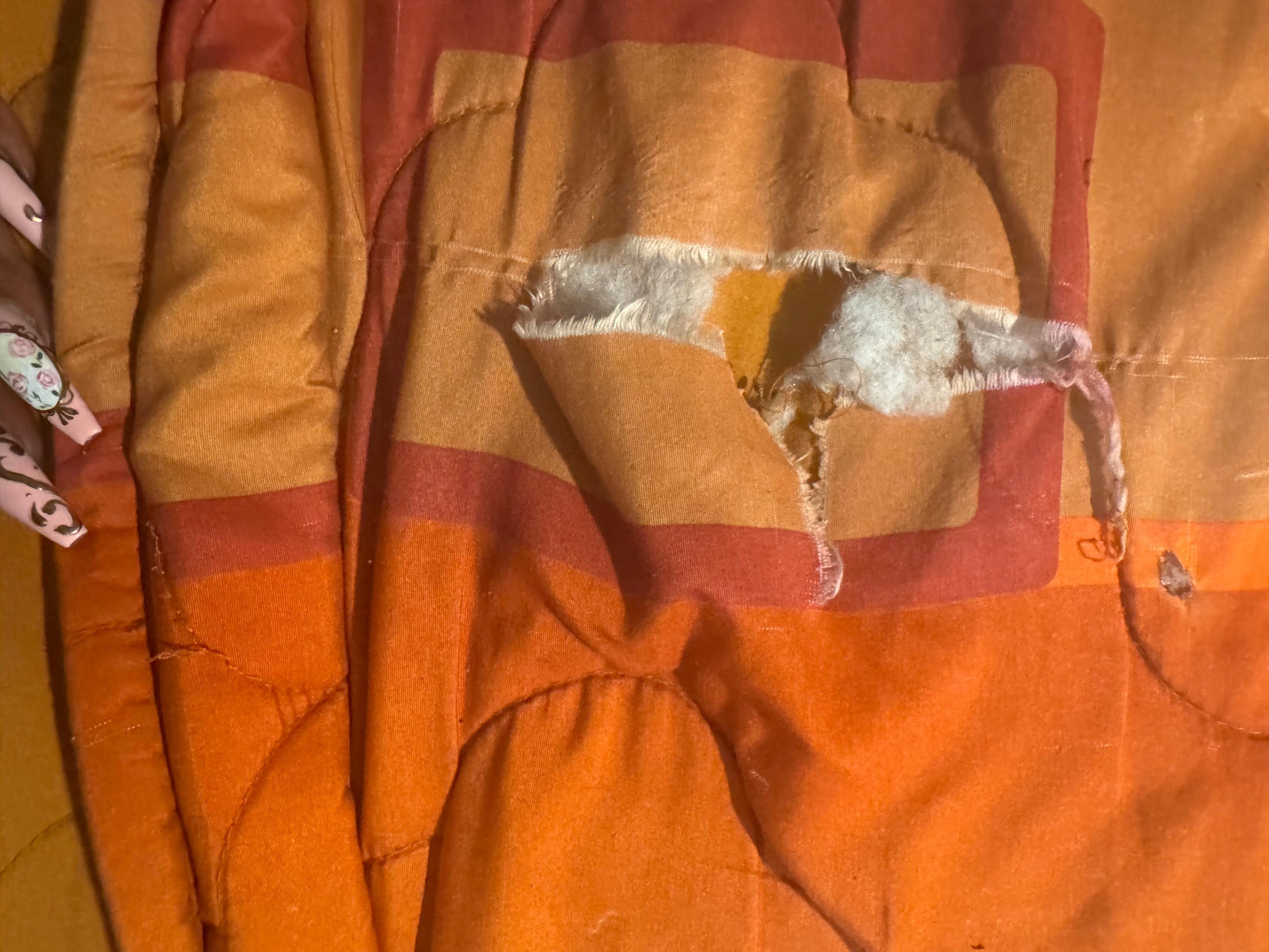 Thin torn hole filled bed spread 