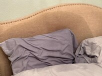 A closeup of the wet bed I declined to sleep in.
