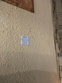 Health Warning on outside wall of unit