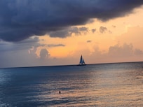 Sunset on the beach in front of the hotel.