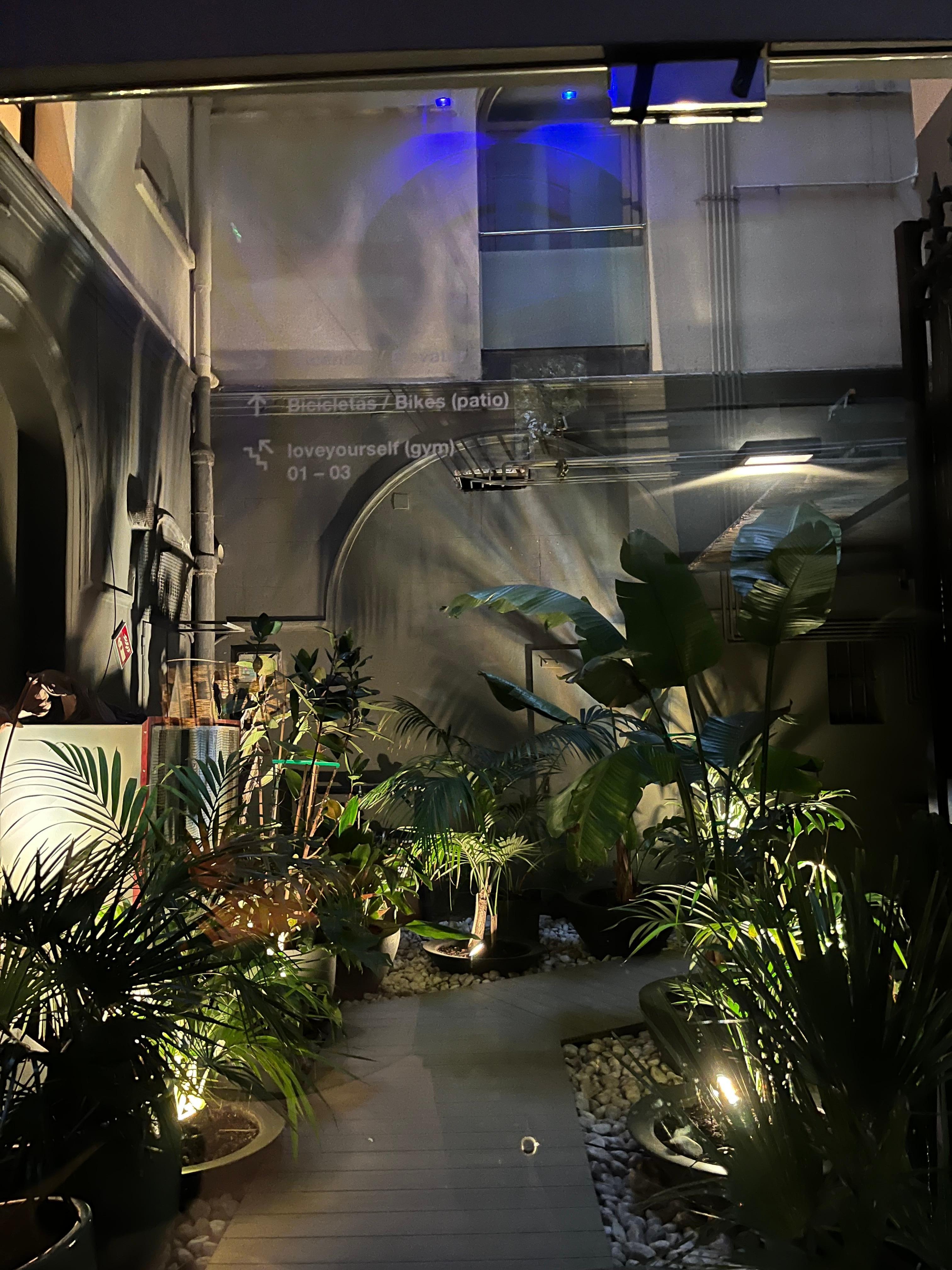 Hotel entrance with card. An interior green space to store your bike!