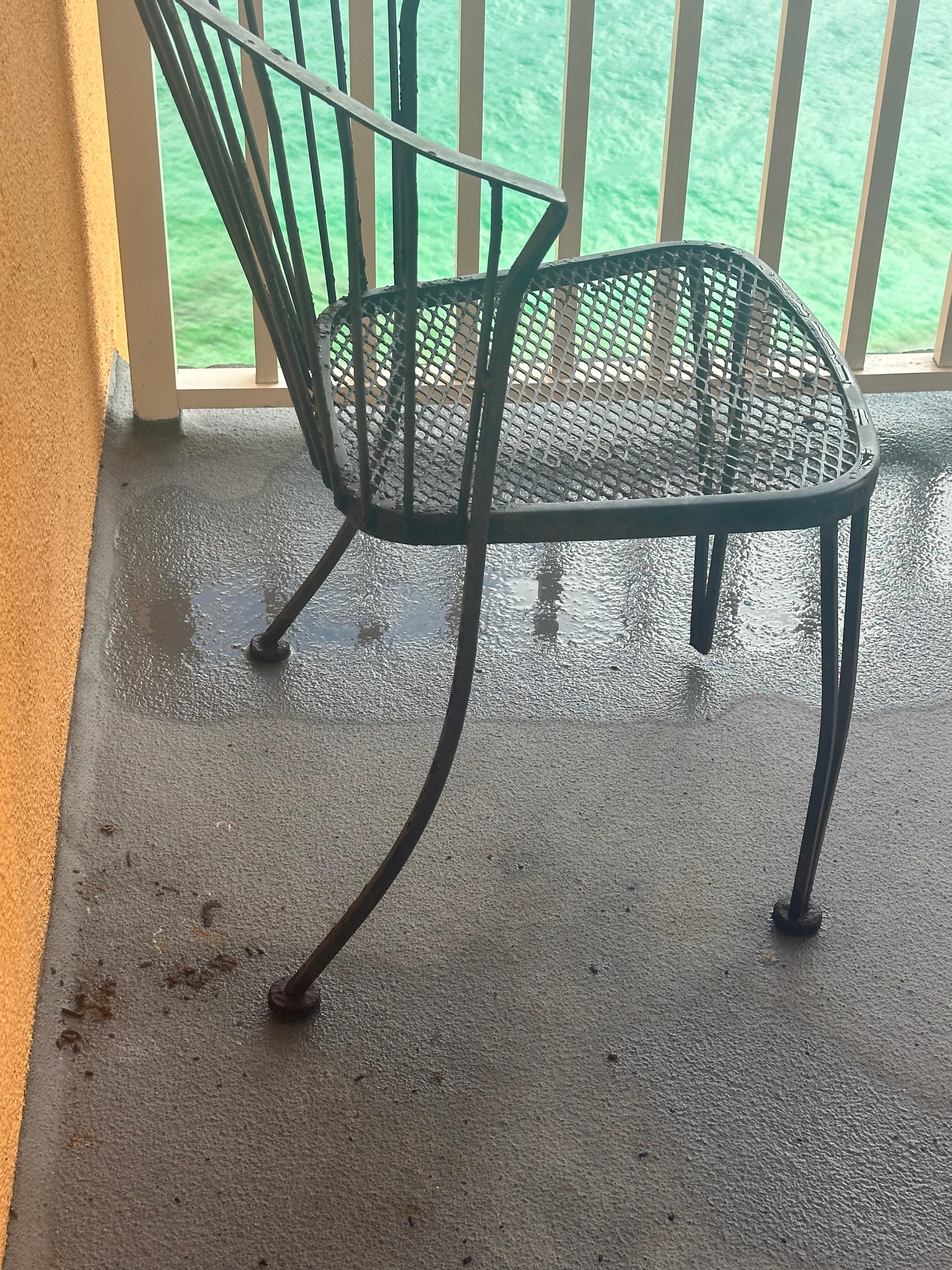 Rusted chairs missing parts of the leg