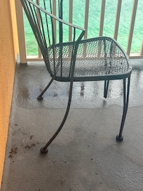 Rusted chairs missing parts of the leg