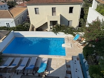 view of the pool from the room upstairs