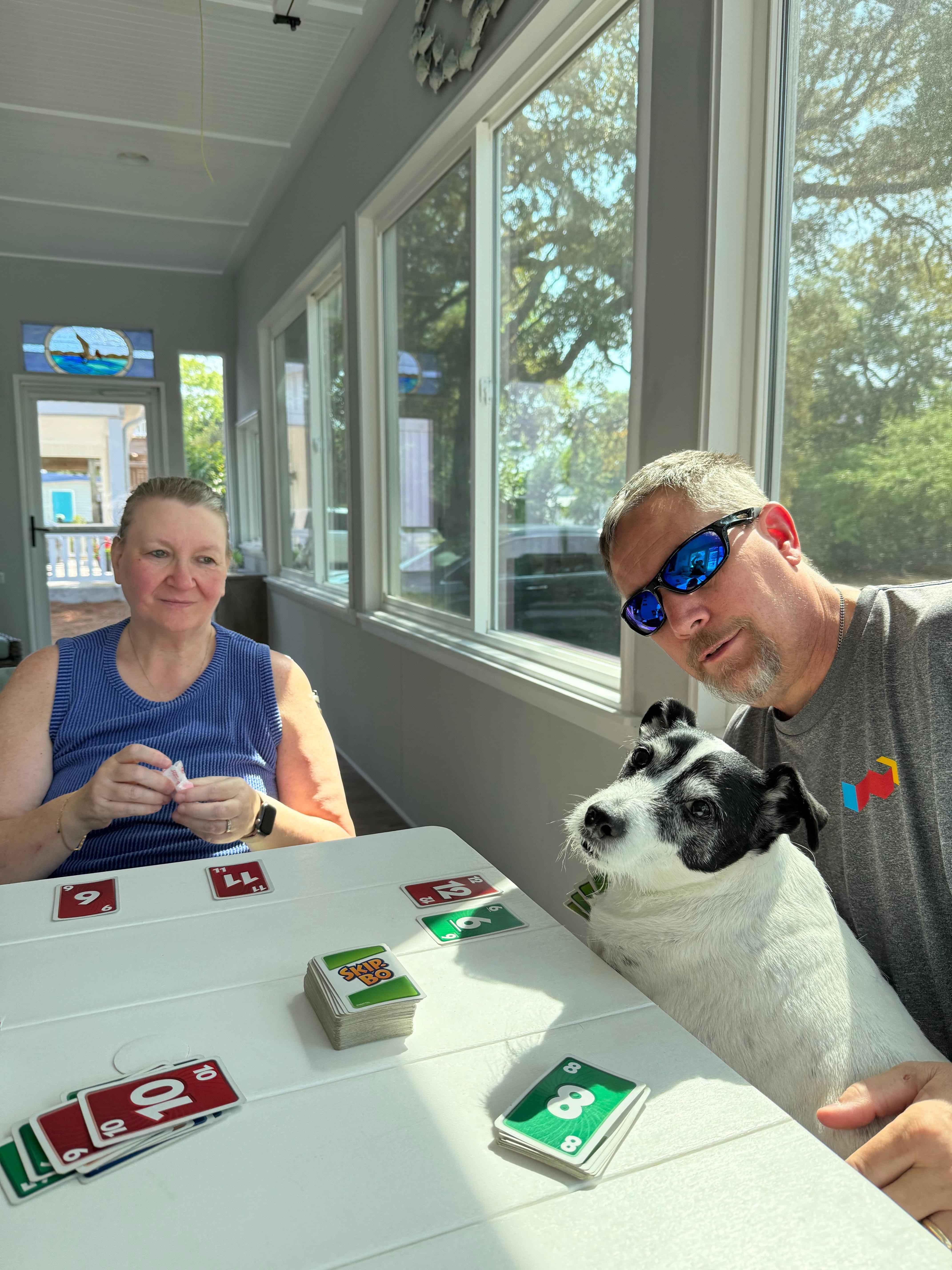 Cards on the porch with our pooch