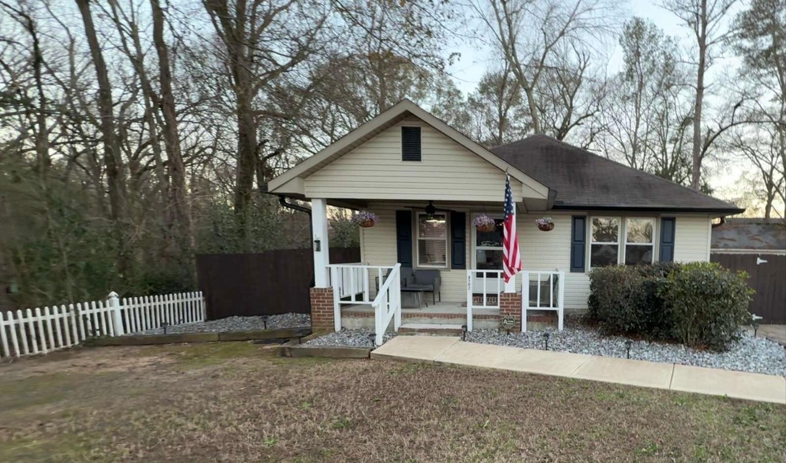 Perfect porch to have your morning coffee while listening to nature in the nearby wooded area 