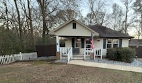 Perfect porch to have your morning coffee while listening to nature in the nearby wooded area