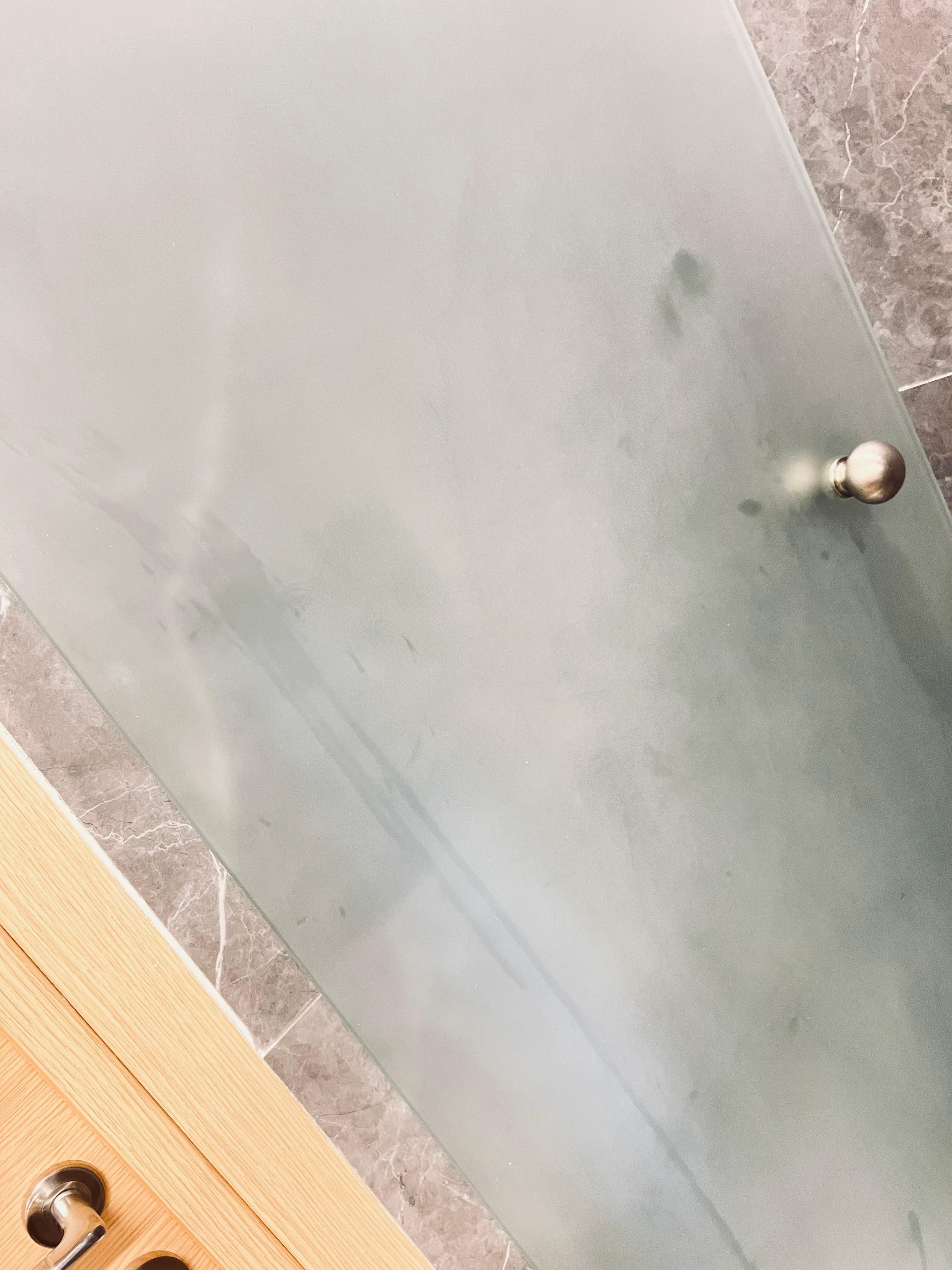 Shower door needs to be sprayed and cleaned. 