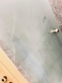 Shower door needs to be sprayed and cleaned.