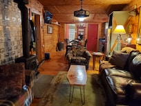 Living space, kitchen/dining room, bathroom at far end