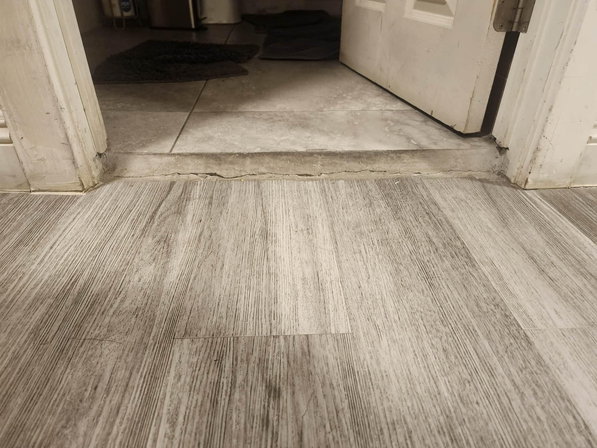 Uneven transition from hallway to bathroom