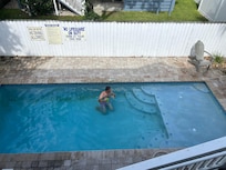 Member of our group trying to clean the pool.