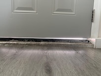 The installation gap allowing gnats to enter.
