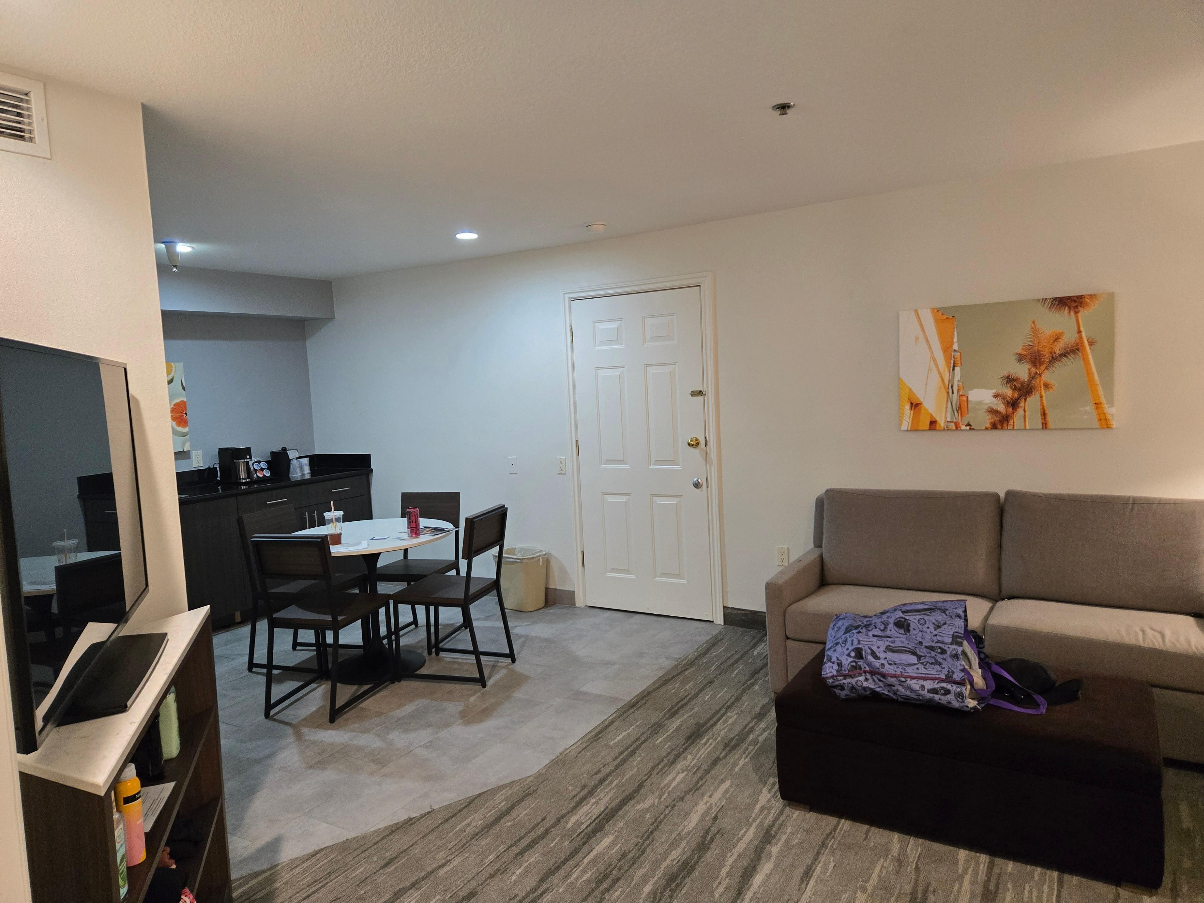 No kitchen. I wasn't planning on writing a review (just sending photos to family) so I didn't take a head on picture but there was no stove, only a sink, microwave, and mini fridge.