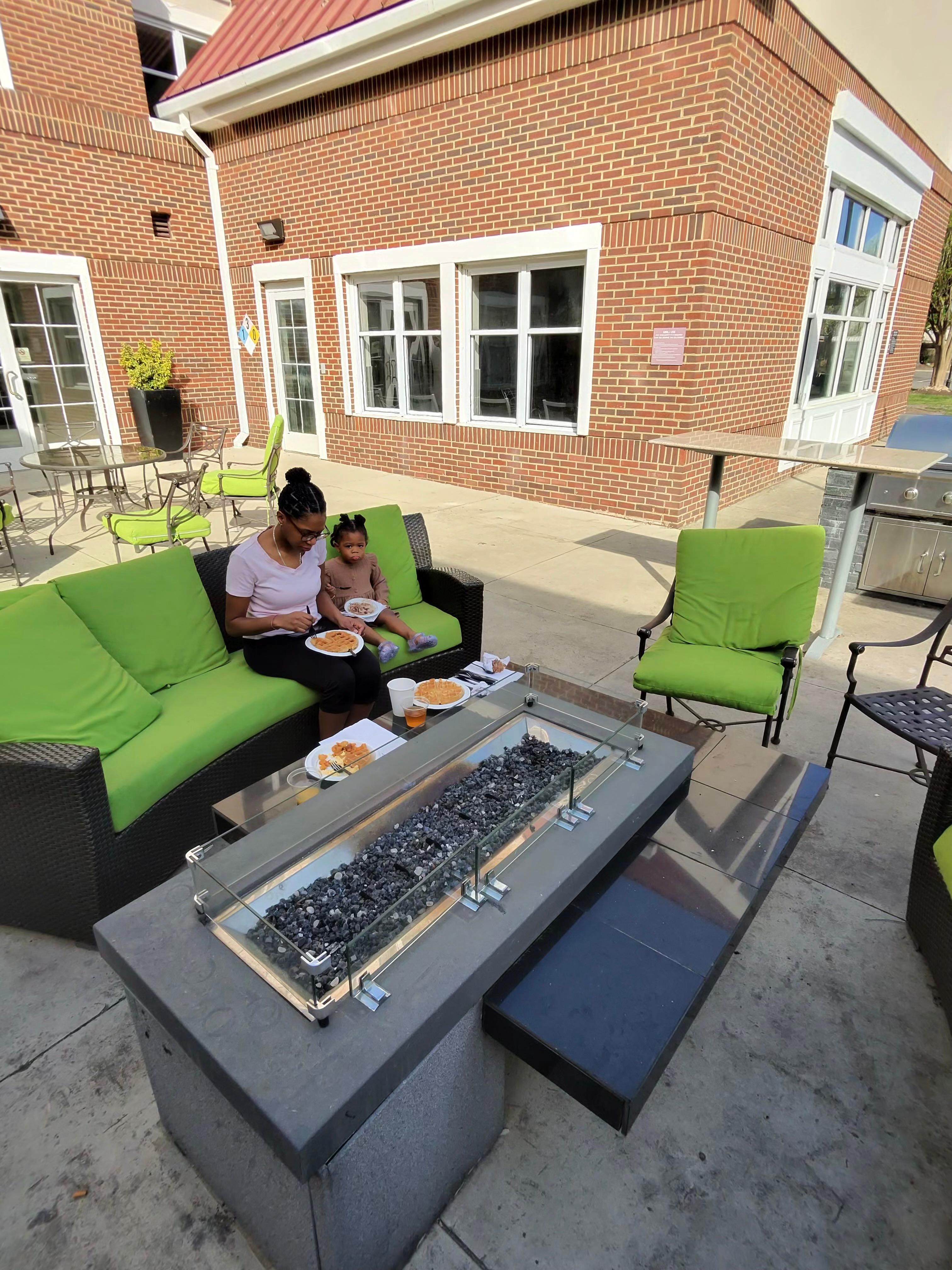 Wife and daughter having breakfast at the fire pit. 