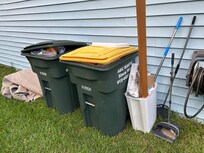 Over flowing trash cans and the trash can from the kitchen.