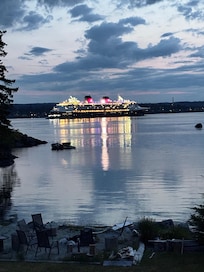 Disney cruise ship
Passing by lit up and very happy sounding