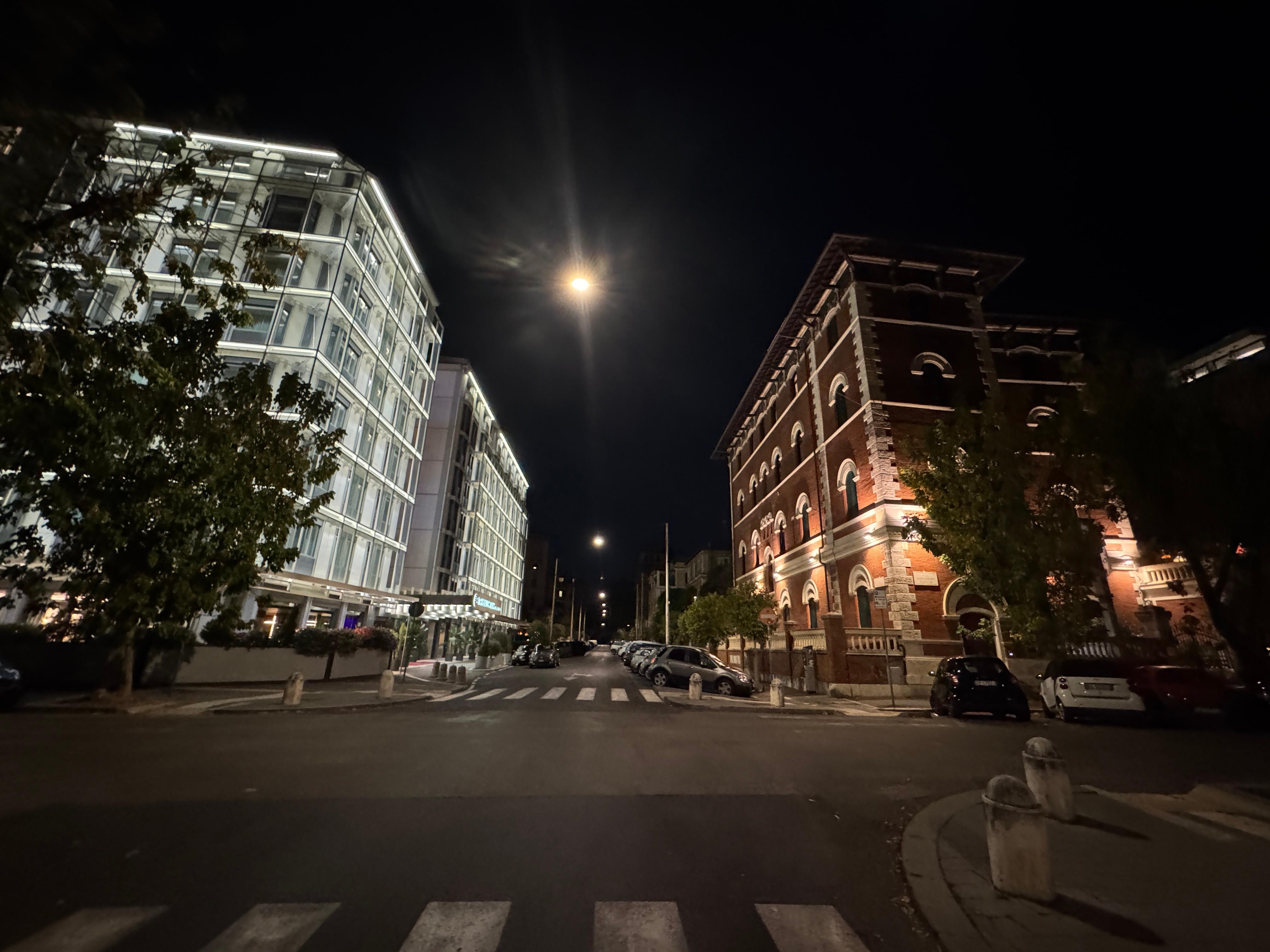 Evening view of the hotel on the left 