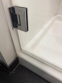 Shower doors were dirty.