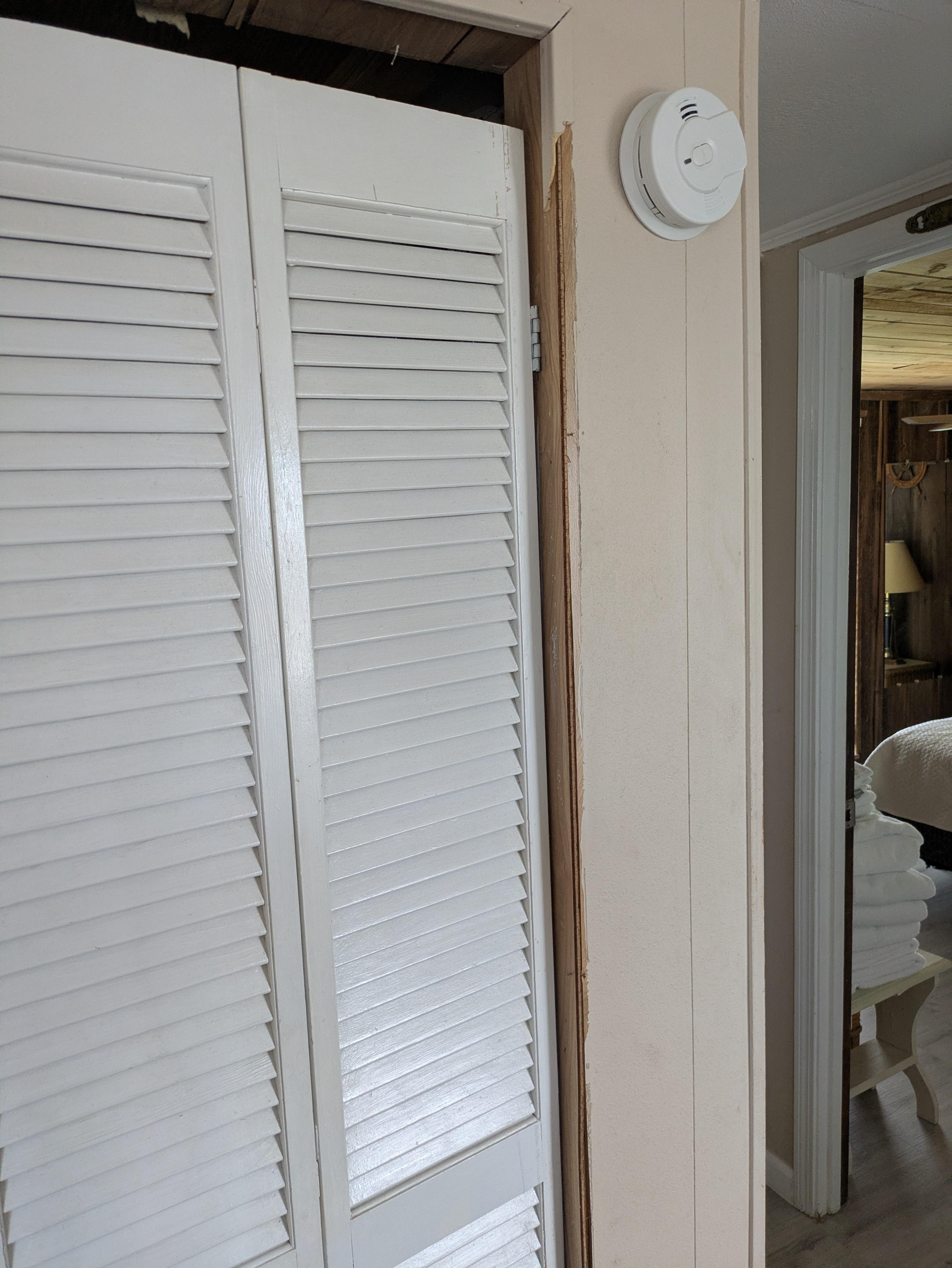 Missing trim along the closet. This closet hardly shut and was filled with random stuff - a vacuum, a broken broom and other miscellaneous items that should not have been there. 