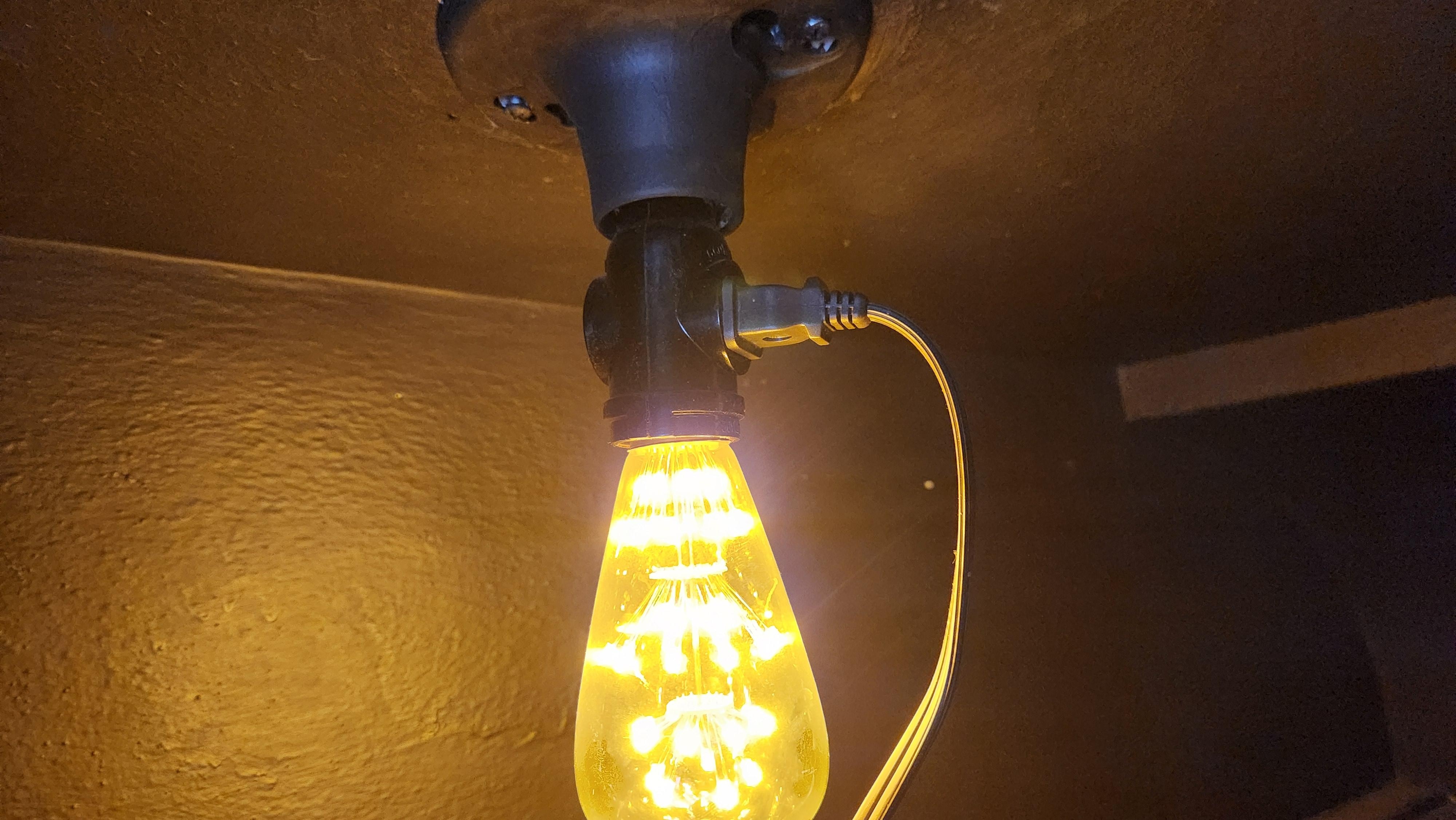 It's not legal to use one of these outlet adapters in this way. the wire went into a cabinet, where it was spliced with wire nuts. It was a dangerous situation.