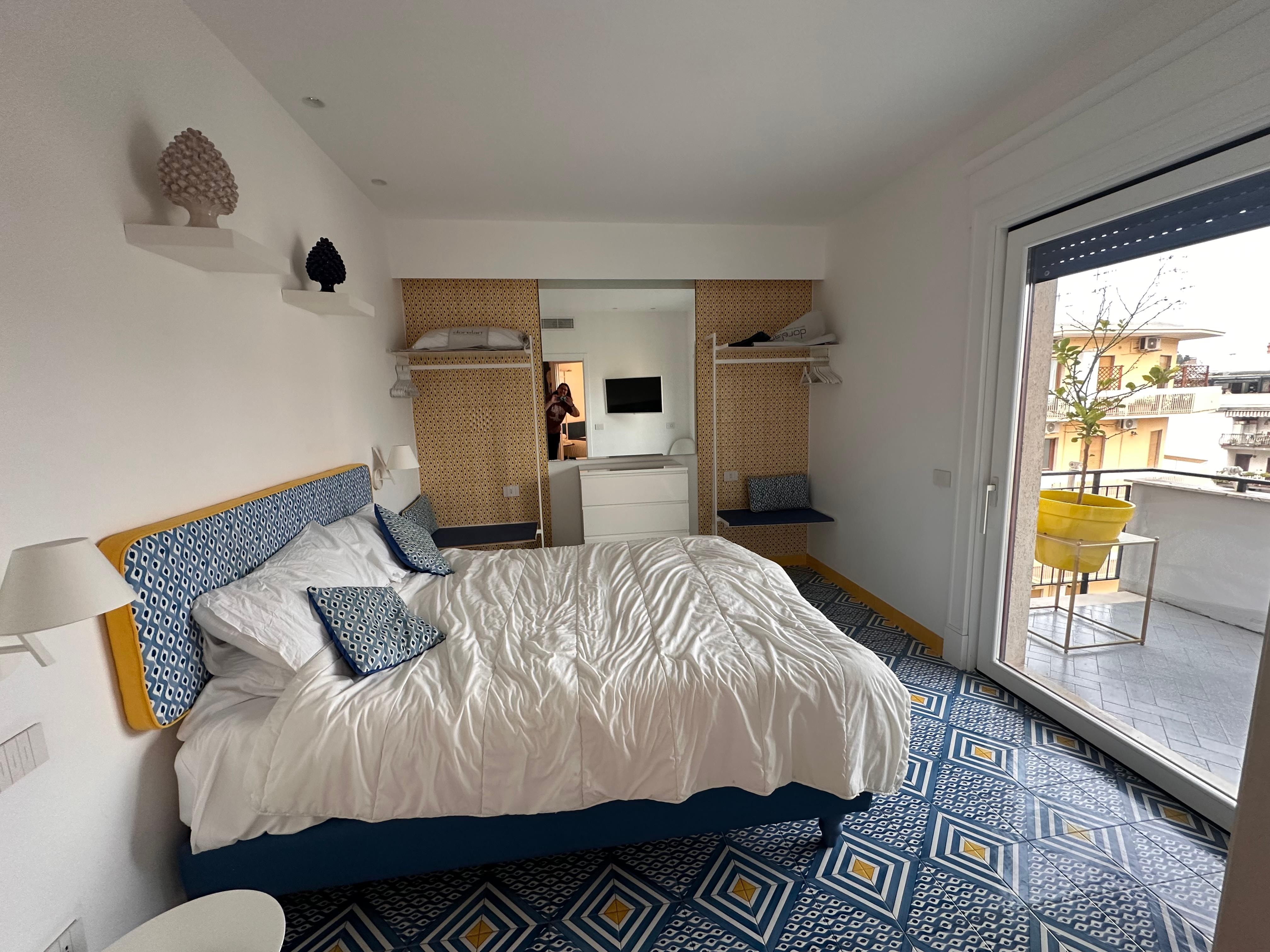 Master bedroom with nice view out the door to patio