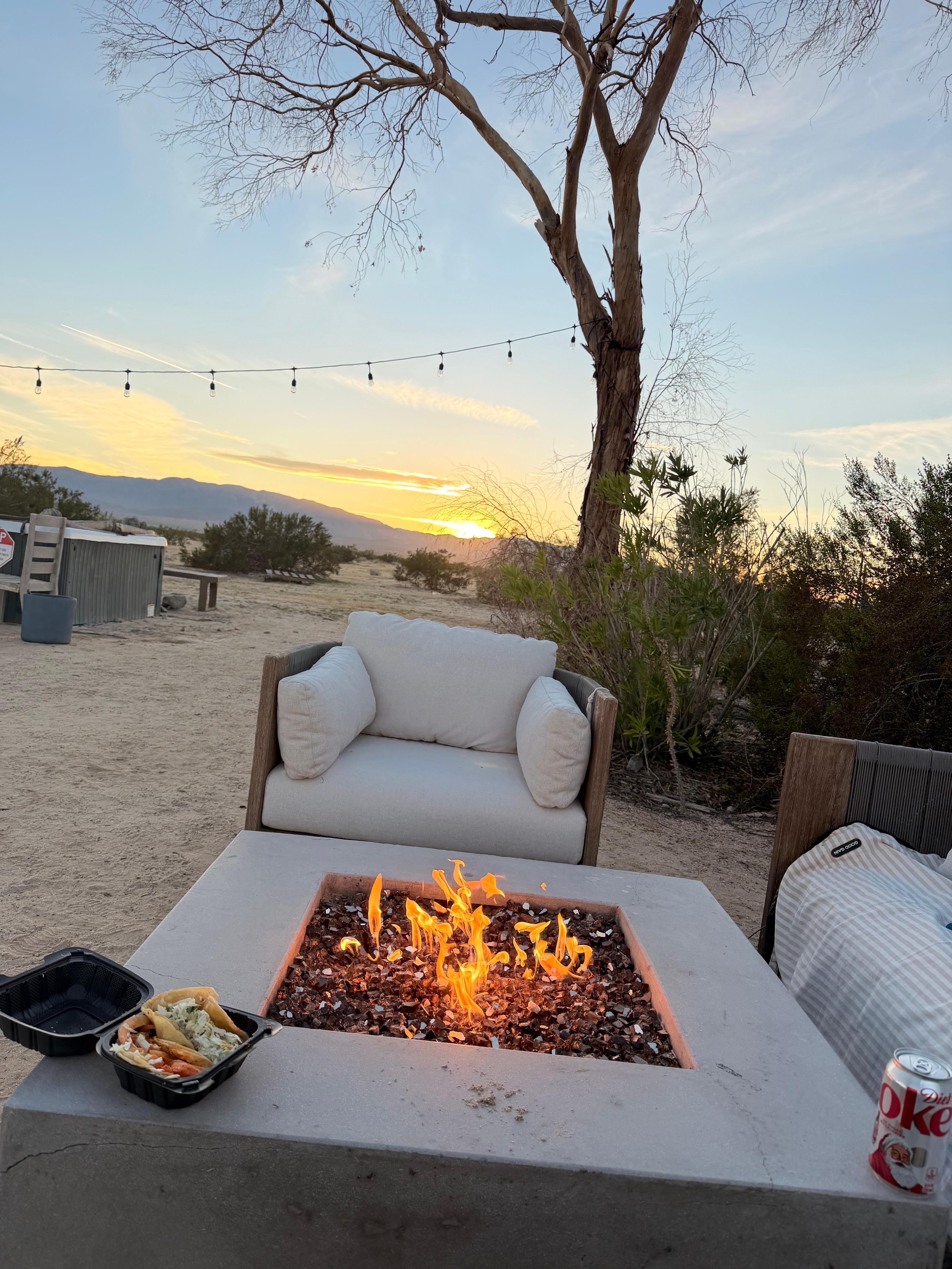 Sunset from fire pit with view of hottub