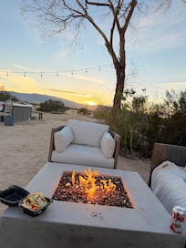 Sunset from fire pit with view of hottub