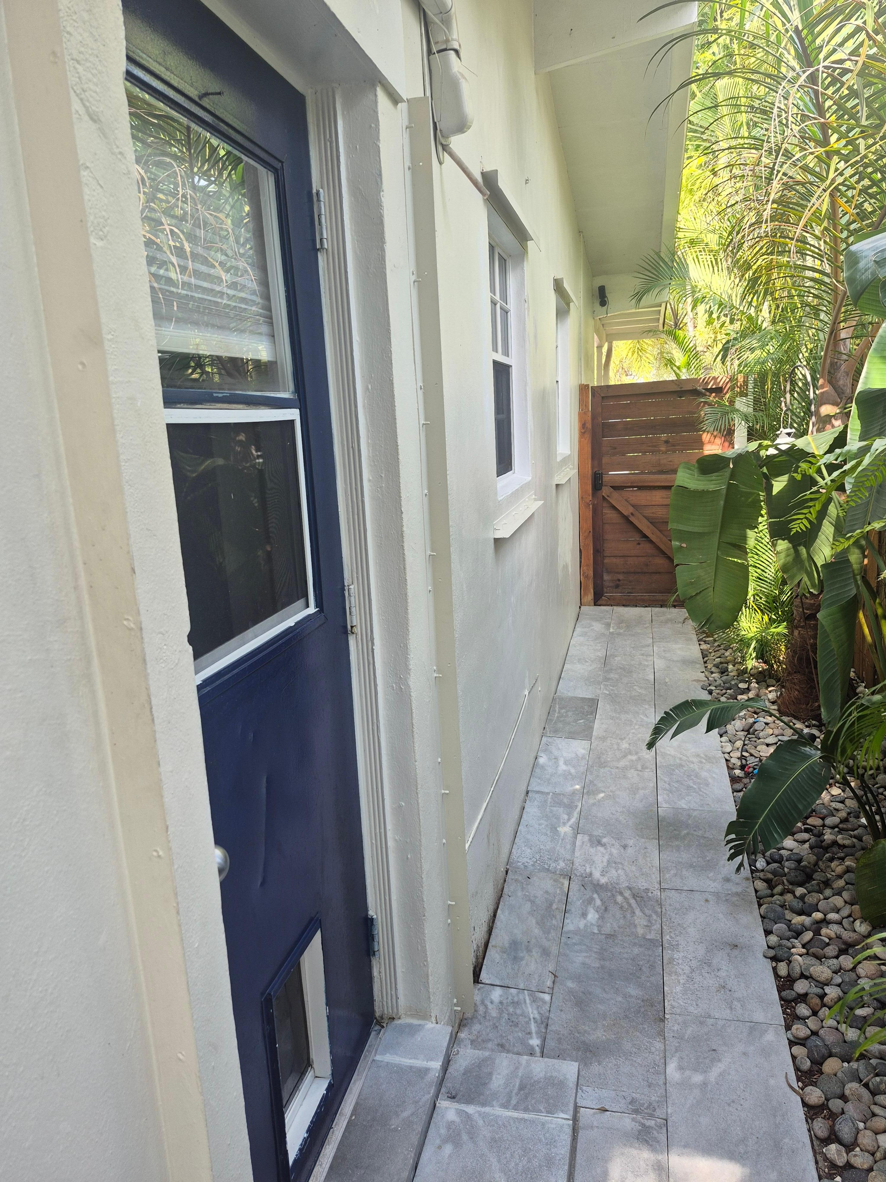 Secure side entrance. Blue door on left is the studio apt.