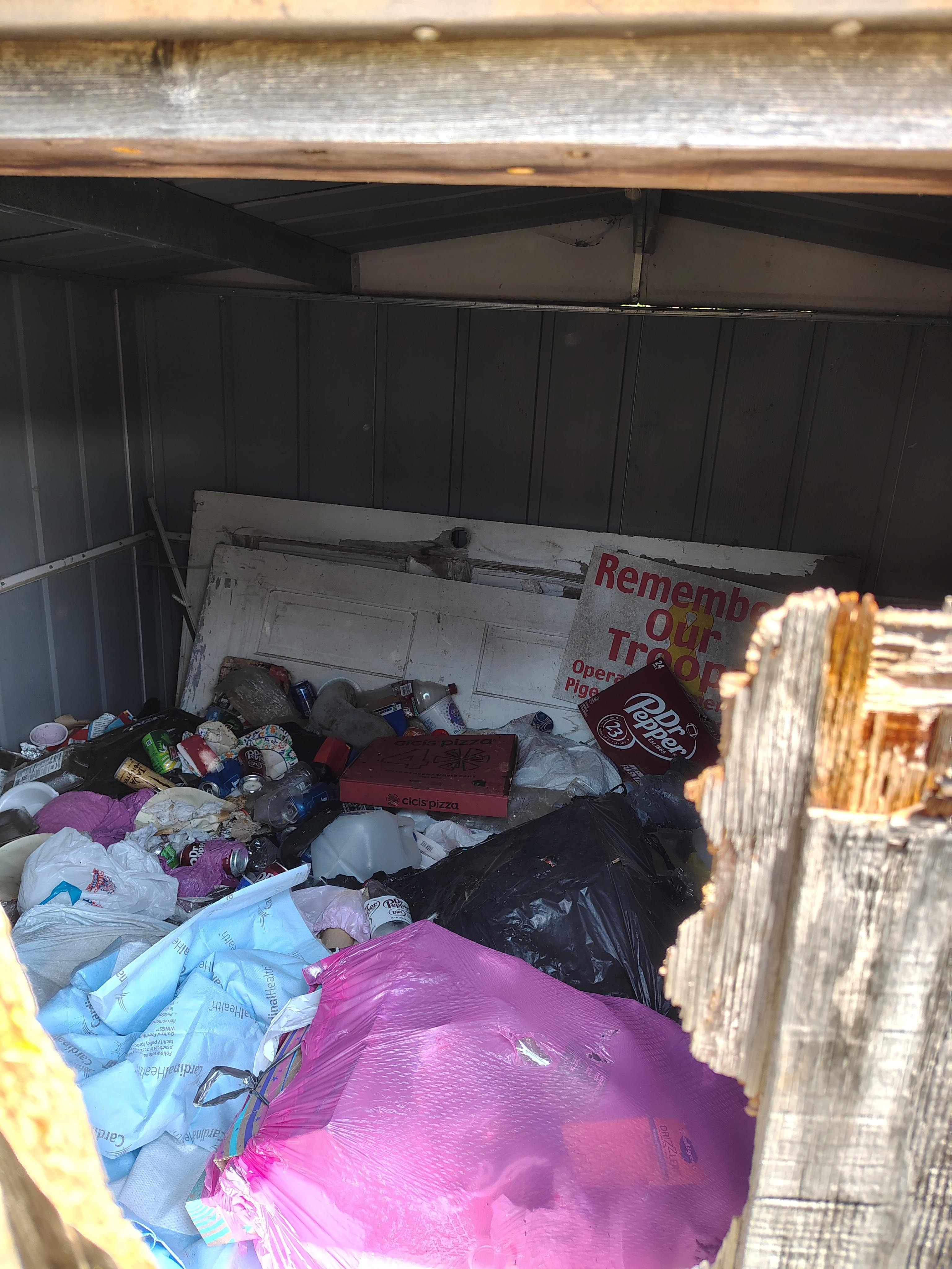 Trash shed full hard to even get open