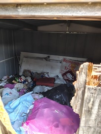 Trash shed full hard to even get open